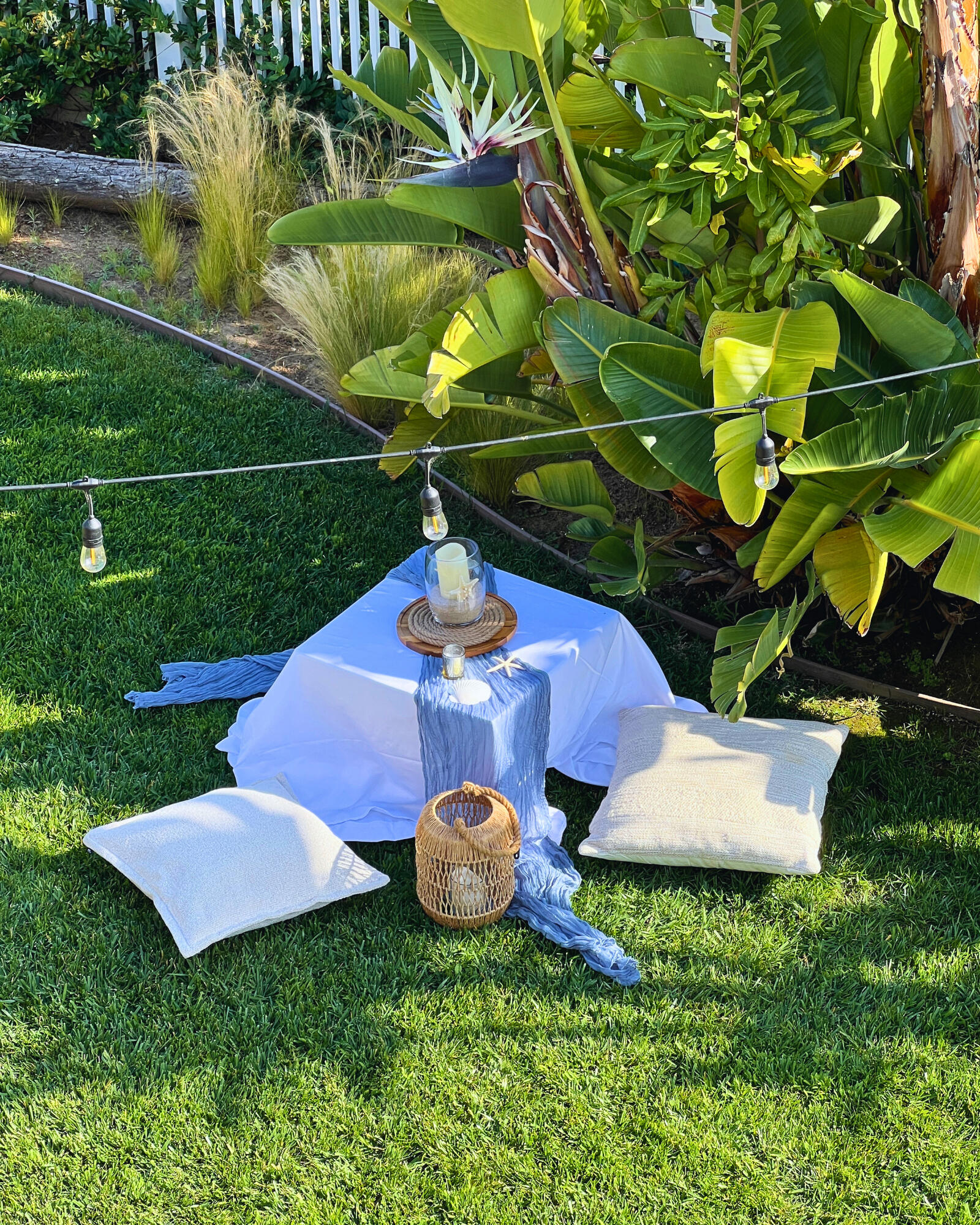 Intimate Outdoor Dinner Party Event Outdoor dinner party with string lights and florals